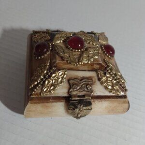 Small trinket storage organizer with gold tone metal design & red faux jewels.